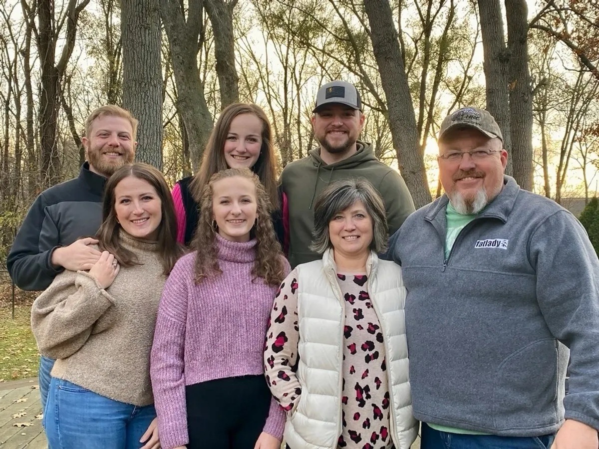 Chad and Lori Newcomer with family and Labs